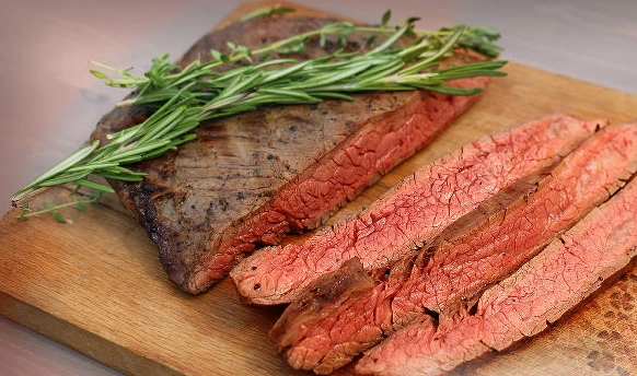 Flank Steak Marinated in Worcester Sauce on a Charcoal Grill