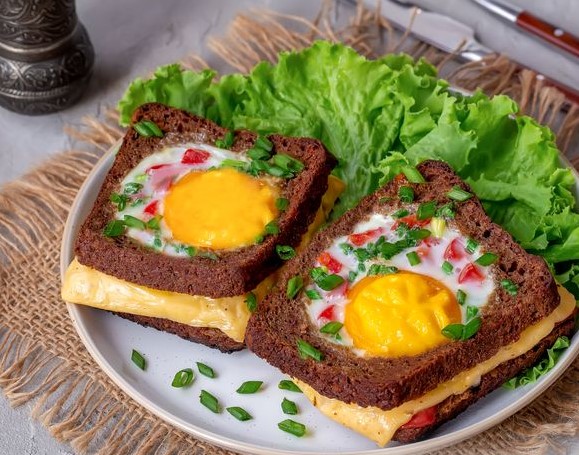 Hot Sandwiches with Scrambled Eggs, Sausage, Cheese, and Tomatoes
