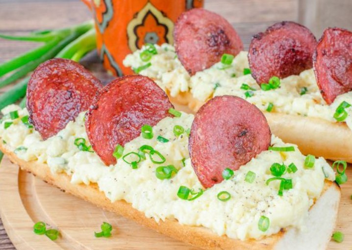 Scrambled Eggs with Melted Cheese and Sausage, on a Baguette