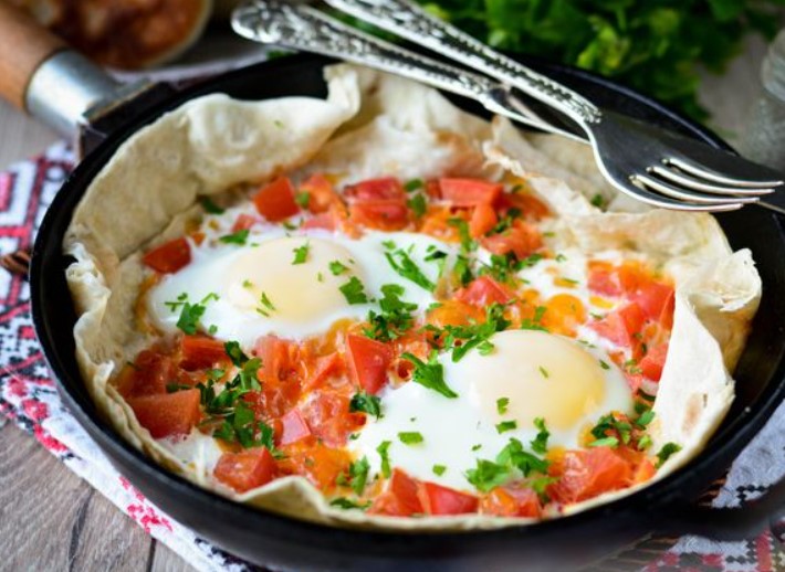 Fried Eggs on Pita Bread, with Cheese and Tomatoes