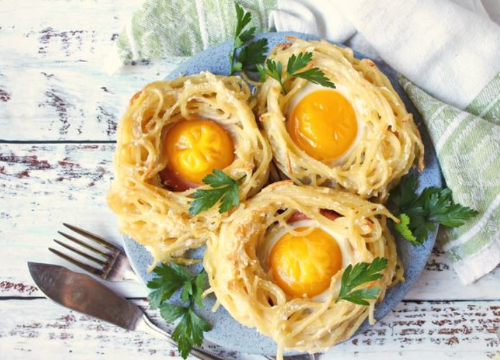 Fried Eggs in Spaghetti and Sausage “Nests”