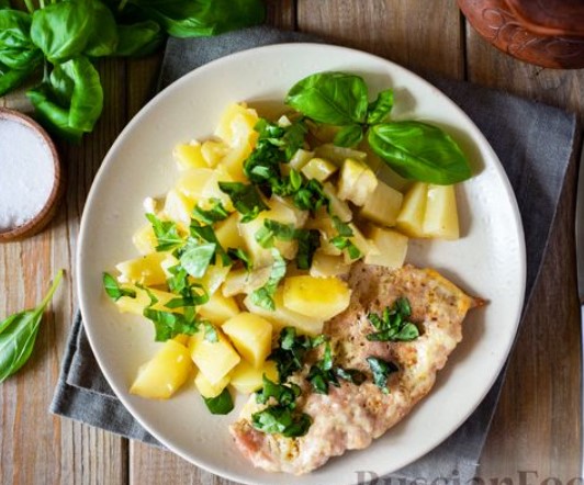Pork Chops Baked With Young Potatoes and Zucchini