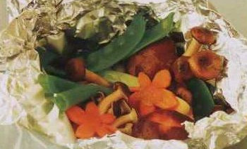 Fish Baked with Mushrooms and Vegetables in Foil