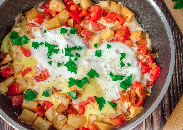 Fried Eggs with Potatoes, Tomatoes, and Onions