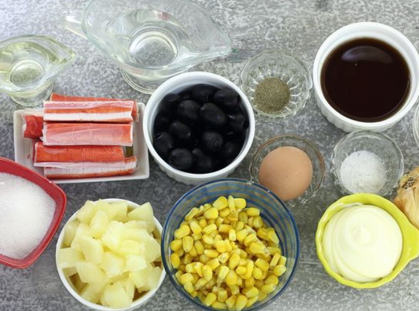 Salad with Crab Sticks, Pineapple, Olives and Corn step 1