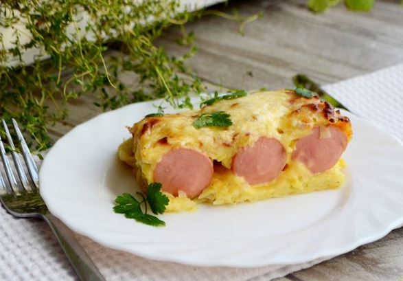 Potato Casserole with Sausages Wrapped in Thin Slices of Cheese