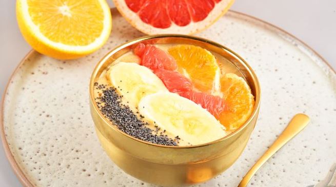 Citrus Smoothie Bowl with Banana and Oat Flakes