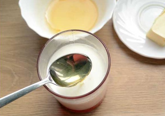 Add liquid honey to this. In warm milk, honey will quickly dissolve