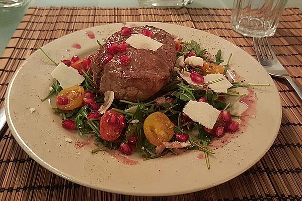 Beef Fillet in Pomegranate Sauce on Rocket Salad with Parmesan Chips