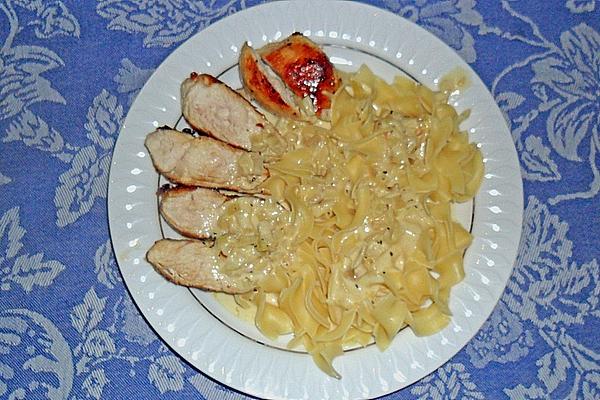 Fried Chicken Breast in Garlic – Cream – Sauce on Tagliatelle
