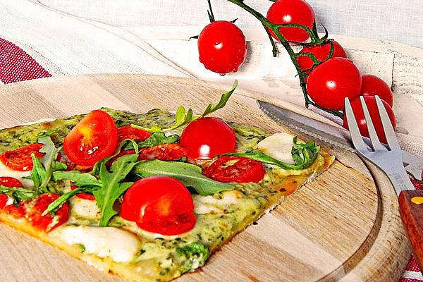 Tarte Flambée with Rocket, Pesto, Cherry Tomatoes and Mozzarella