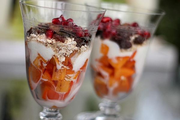 Vegan Breakfast with Persimmons, Oatmeal, Sultanas and Soy Yoghurt