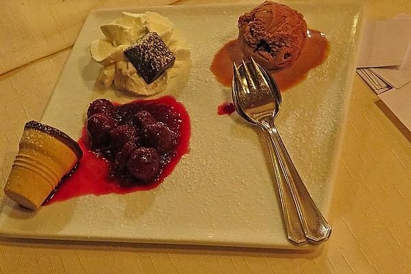 Chocolate Cakes with Liquid Core, Cherry Sauce and Ice Cream