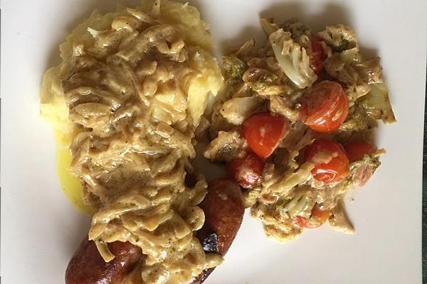 Fresh Veal Sausage on Caramelized Herder Cheese and Savoy Cabbage with Potato and Parsnip Puree and Onion Mustard Sauce