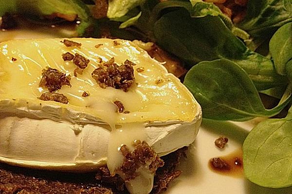 Liquid Camembert on Crispy Pumpernickel with Walnut Lamb`s Lettuce
