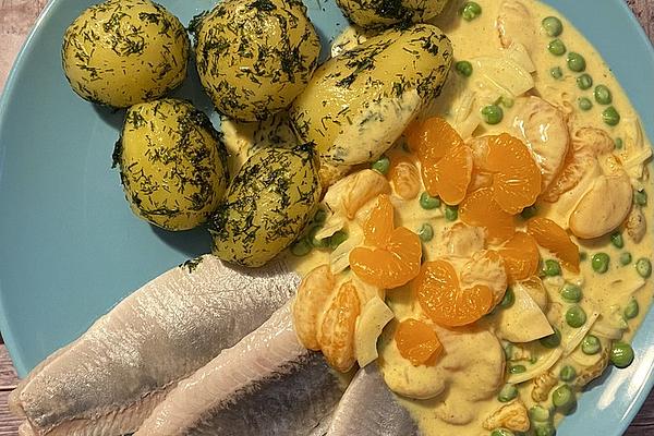 Matjes Fillets with Fruity Curry Dip and Jacket Potatoes Tossed in Butter