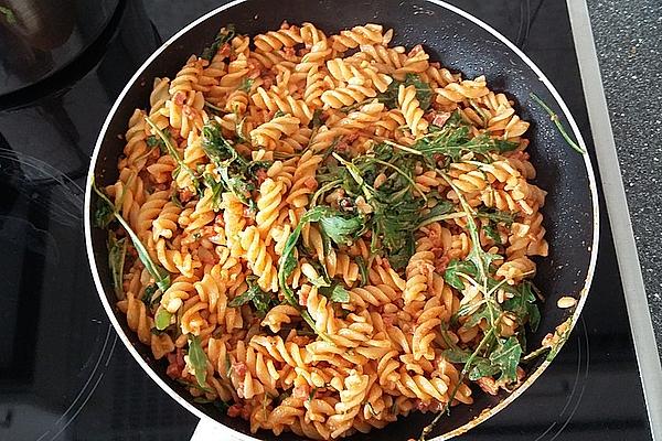Pesto Arugula Pasta with Pine Nuts and Bacon