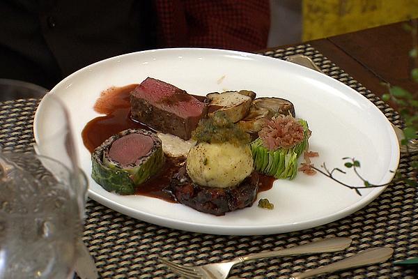 Saddle Of Venison with Pointed Cabbage, Porcini Mushrooms and Black Pudding Dumplings