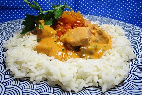 Sliced ​​roast Beef in Cream Sauce on Rice