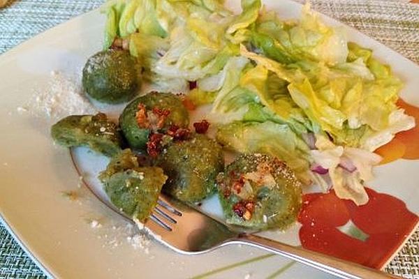 Spinach Dumplings Made from Potato Dough with Basil Butter